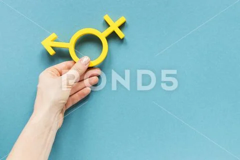 Photograph: Hand holding colorful equality symbol High resolution photo ...