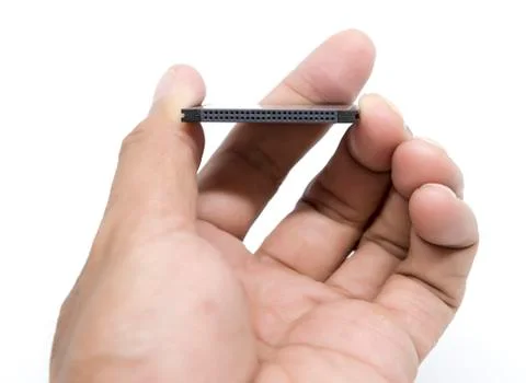 Hand holding compact flash memory card Stock Photos
