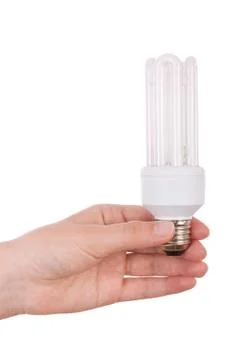 Hand holding compact fluorescent light bulb isolated on white. Stock Photos