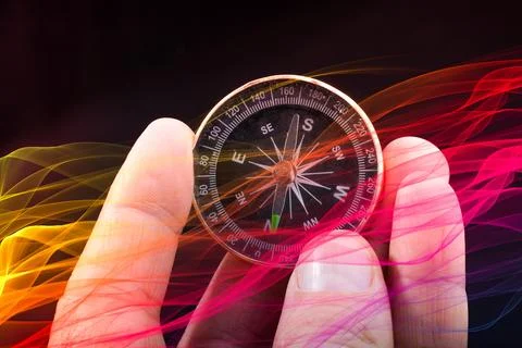 Hand holding compass in hand for navigation guide Stock-Fotos