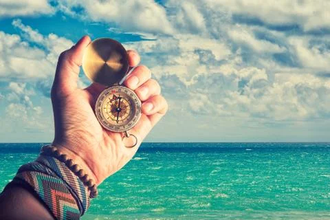 Hand holding compass Stock Photos