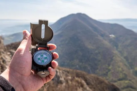 Hand holding a compass Stock Photos