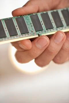 Hand holding computer chips 库存照片