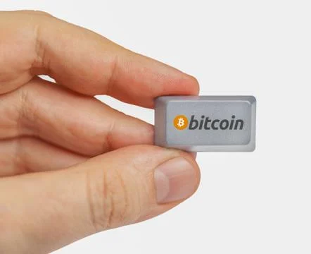 Hand holding computer key with bitcoin logo. cryptocurrency concept Stock Illustration
