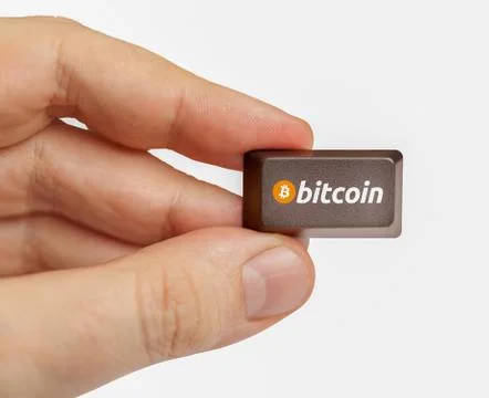 Hand holding computer key with bitcoin logo. cryptocurrency concept Stock Illustration