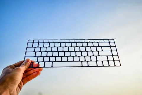 Hand holding computer keyboard for communication technology concept,Technolog Stock Photos