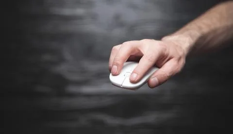 Hand holding computer mouse. Technology, Business Stock Photos
