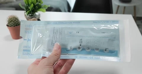 Hand holding Coronavirus self test kit, close up. Stock Footage 155075046