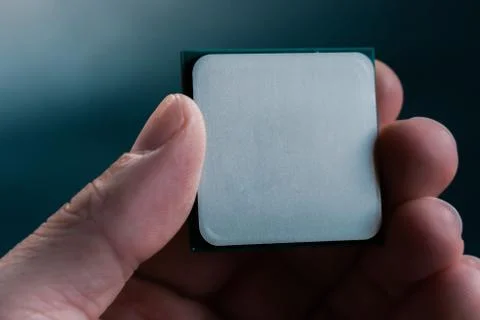 Hand holding CPU. Coonsumer 7 nanometer desktop CPU,  processoor. Informatic  Foto stock