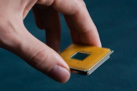 Hand holding CPU. Coonsumer 7 nanometer desktop CPU,  processoor. Informatic  Foto stock