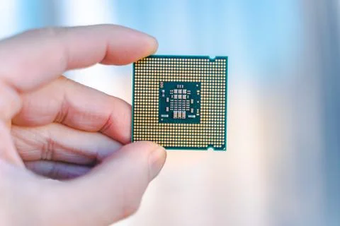 Hand holding CPU.  desktop CPU,  processoor. Informatic chip, PC component. M Foto stock