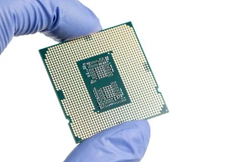 Hand holding a CPU in isolated white blackground Stock-Fotos