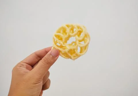 Hand holding a cracker Stock Photos