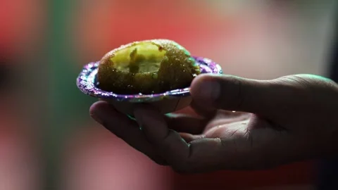 Hand Holding Crispy Golgappa Filled with Pani Puri Water  Popular Indian St.. Stock Footage 339724846