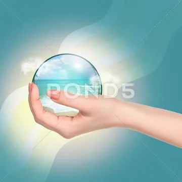 Hand holding crystal ball with beach and sea Stock Photos
