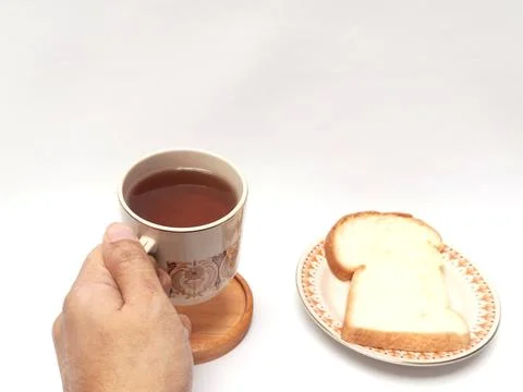Hand Holding Cup of Black Coffee with Slice Bread White Background Foto stock