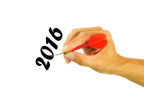 Hand holding dart isolated on white background. text for 2016 Stock Photos