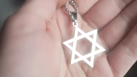 Hand Holding a David Star Closeup of Magen David Stock Footage 240782863