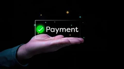 Hand holding digital payment icon with green check mark Stock Photos