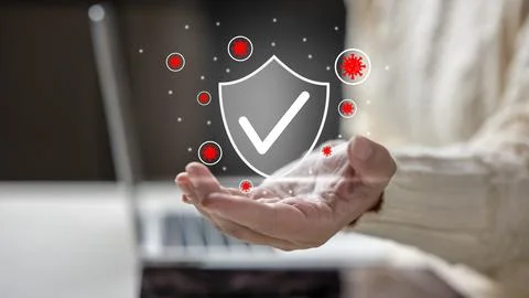 Hand holding a digital shield with a checkmark protecting against floating re Stock Photos
