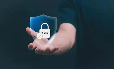 Hand holding digital shield with lock for security Stock Photos