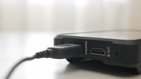 Hand holding disconnect HDMI cable from external monitor device. Plug and Stock Footage 157752429