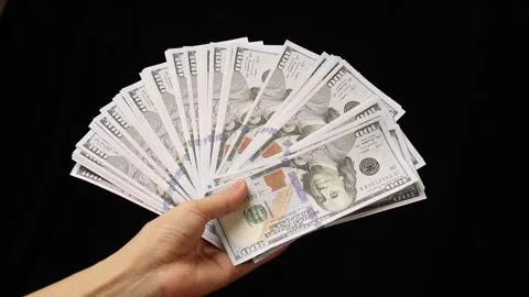Hand holding a dollar bill Stock Footage 226480945