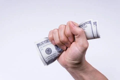 A hand holding a dollar Stock Photos