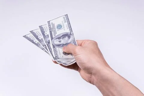 A hand holding a dollar Stock Photos