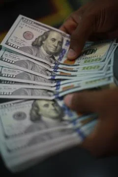 Hand holding dollar Stock Photos