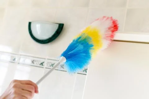 Hand holding a duster clean Stock Photos