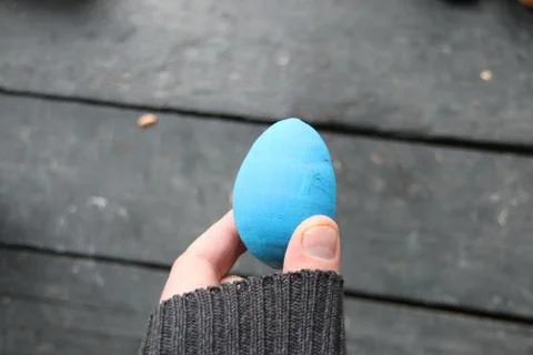 Hand holding an easter egg Stock Photos