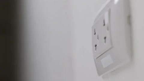 Hand holding Electric plug put on multiple socket. Electrical equipment, Stock Footage 152753992