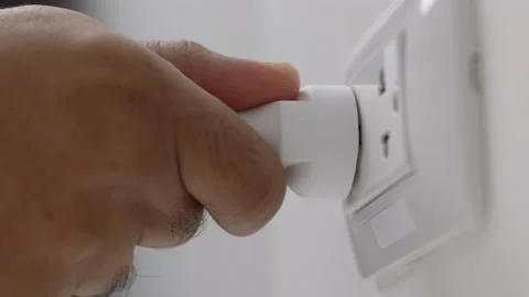 Hand holding Electric plug put on multiple socket. Electrical equipment. Stock Footage 152754094