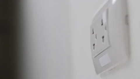 Hand holding Electric plug put on multiple socket. Electrical equipment. Stock Footage 152754169