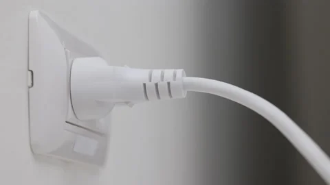 Hand holding Electric plug put on multiple socket. Electrical equipment. Stock Footage 152754373