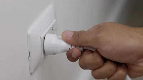 Hand holding Electric plug put on multiple socket. Electrical equipment. Stock Footage 152754448