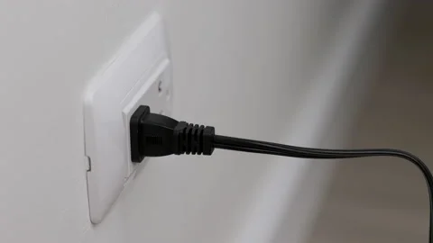 Hand holding Electric plug put on multiple socket. Electrical equipment. Stock Footage 152754515
