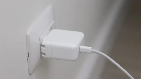 Hand holding Electric plug put on multiple socket. Electrical equipment. Stock Footage 152754553