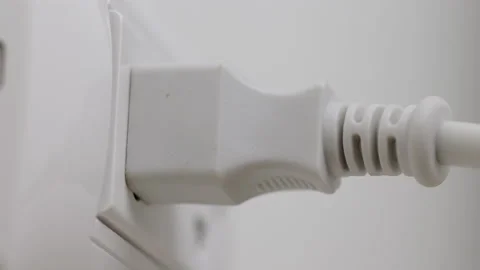 Hand holding Electric plug put on multiple socket. Electrical equipment. Stock Footage 152754725