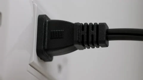 Hand holding Electric plug put on multiple socket. Electrical equipment. Stock Footage 152754782