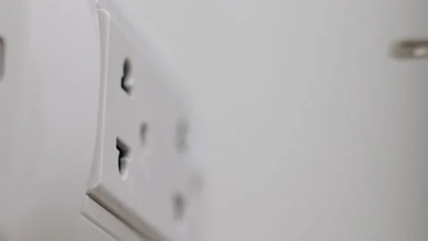 Hand holding Electric plug put on multiple socket. Electrical equipment. Stock Footage 152754915