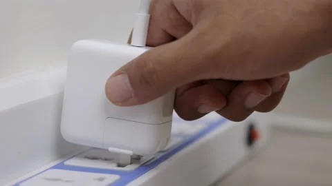 Hand holding Electric plug put on multiple socket. Electrical equipment, electri Stock Footage 152755030