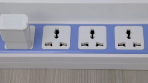 Hand holding Electric plug put on multiple socket. Electrical equipment. Stock Footage 152755390