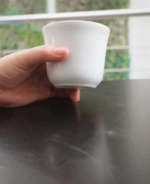Hand Holding An Empty Cup Stock Photos