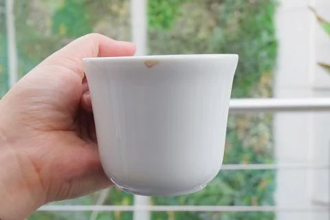 Hand Holding An Empty Cup Stock Photos