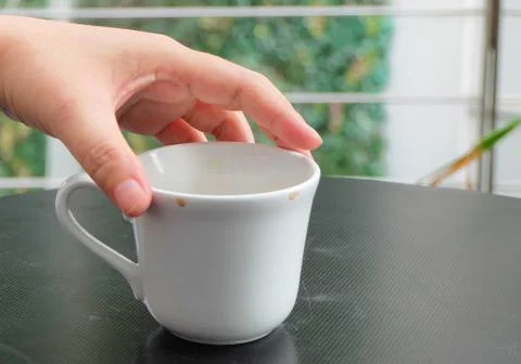 Hand Holding An Empty Cup Stock Photos