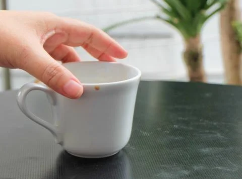 Hand Holding An Empty Cup Stock Photos