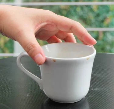 Hand Holding An Empty Cup Stock Photos