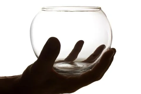 Hand holding an empty glass container Foto stock